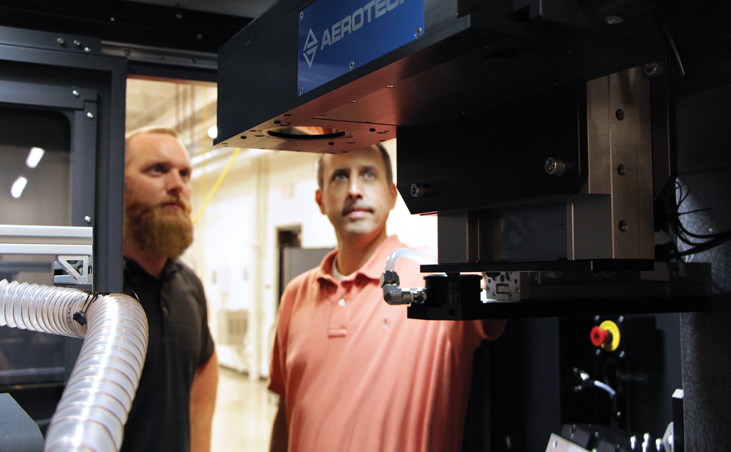 technicians looking inside integrated automation system